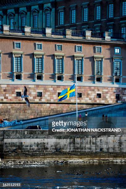 Swedish flag flies at half-mast in downtown Stockholm on March 11, 2013 in honor of Swedish Princess Lilian, who died on March 10, 2013 at the age of...