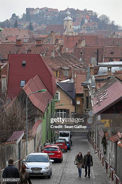 Weekend visitors walk among Saxon-built houses in the historic district on March 9, 2013 in Brasov, Romania. Brasov, in German called Kronstadt, was...