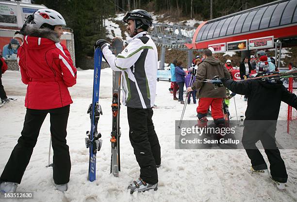 Skiers prepare to take modern gondolas to the summit at the Poiana Brasov ski resort in the Bucegi mountains on March 9, 2013 at Poiana Brasov,...
