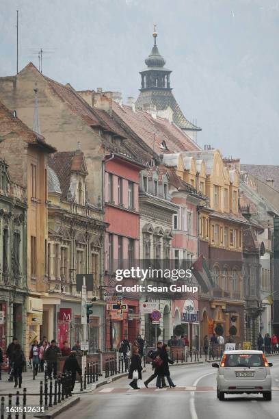 Weekend visitors walk among Saxon-built houses in the historic district on March 9, 2013 in Brasov, Romania. Brasov, in German called Kronstadt, was...