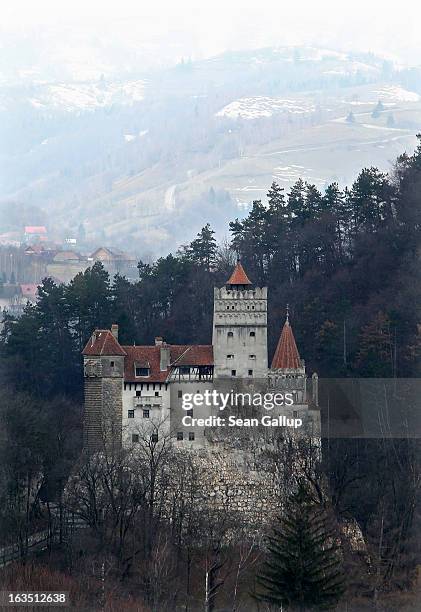 Bran Castle, famous as "Dracula's Castle," stands among Transylvanian mountains on March 10, 2013 in Bran, Romania. Bran Castle's reputation as the...