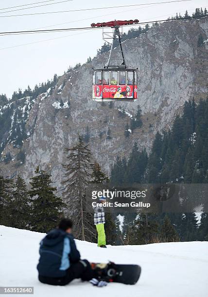 Cable car brings skiers to the summit at the Poiana Brasov ski resort in the Bucegi mountains on March 9, 2013 at Poiana Brasov, Romania. Romania is...