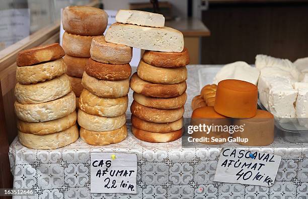 Local smoked mountain cheese, in Romanian called cascaval, is displayed for sale among souvenir shops at Bran Castle, famous as "Dracula's Castle,"...