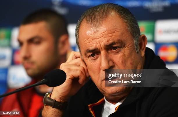 Head coach Fatih Terim is seen next to Burak Yilmaz during a Galatasaray AS press conference ahead of their UEFA Champions League round of 16 match...