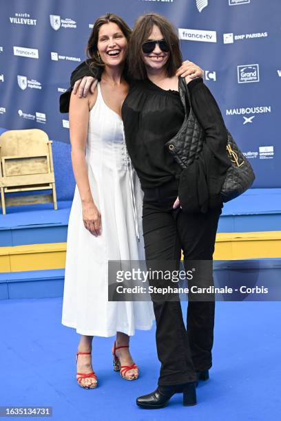 Actresses Laetitia Casta and Beatrice Dalle attend the 'Le Bonheur est pour demain' photocall during Day Two of the 16th Angouleme French-Speaking...
