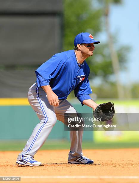 Andy LaRoche of the Toronto Blue Jays fields during the spring training game against the Detroit Tigers at Joker Marchant Stadium on March 6, 2013 in...