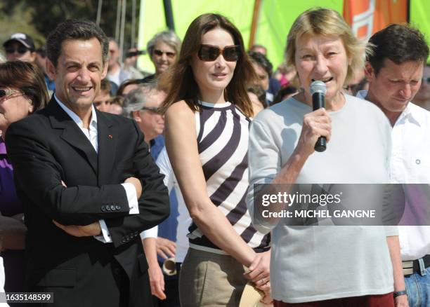 French President Nicolas Sarkozy and wife, First Lady Carla Bruni-Sarkozy listen to Marisa Bruni-Tedeschi , Carla Sarkozy's mother, as attending the...