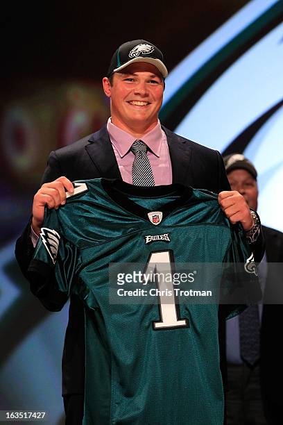 Danny Watkins, #22 overall pick by the Philadelphia Eagles, holds up a jersey on stage during the 2011 NFL Draft at Radio City Music Hall on April...