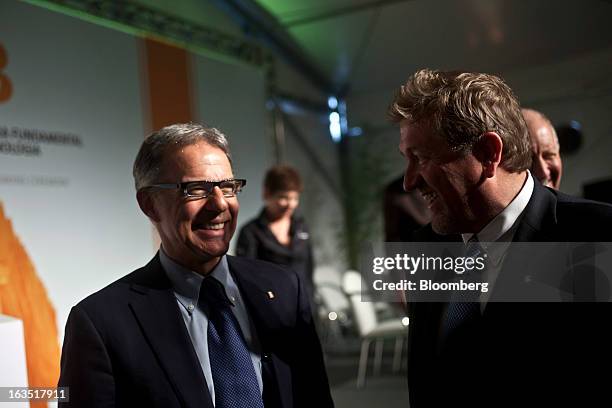 Nelson Silva, president of BG Brazil, left, speaks with Chris Finlayson, chief executive officer of BG Group Plc, during the groundbreaking for BG's...