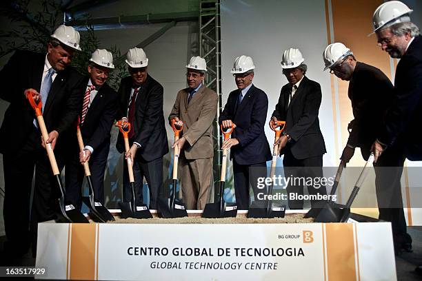 Chris Finlayson, chief executive officer of BG Group Plc, left, listens participates in a groundbreaking ceremony for BG's World Technology Center in...