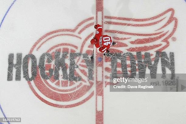 Henrik Zetterberg of the Detroit Red Wings skates in for a shoot-out attempt during an NHL game against the Chicago Blackhawks at Joe Louis Arena on...