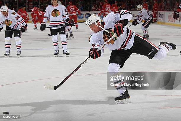 Sheldon Brookbank of the Chicago Blackhawks shoots the puck in warm-ups before an NHL game aghainst the Detroit Red Wings at Joe Louis Arena on March...