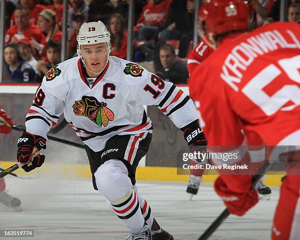 Jonathan Toews of the Chicago Blackhawks follows the play during an NHL game against the Detroit Red Wings at Joe Louis Arena on March 3, 2013 in...