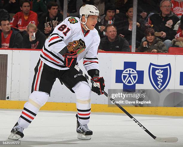 Marian Hossa of the Chicago Blackhawks looks for a pass in his 1,000th NHL game against the Detroit Red Wings at Joe Louis Arena on March 3, 2013 in...