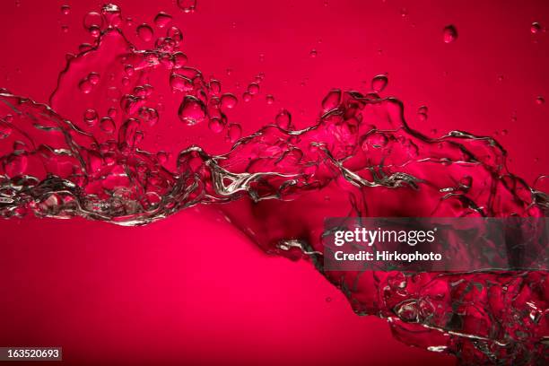 pink water splash - red liquid stock pictures, royalty-free photos & images