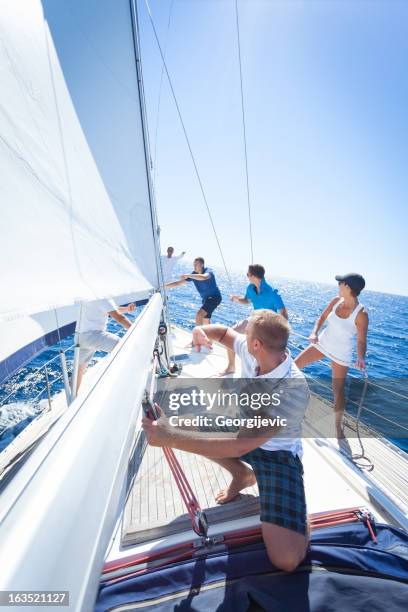 Group Of People Sailing Boat Photos and Premium High Res Pictures ...