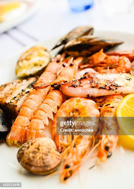 grilled seafood and mixed fish plate - italian calamari stock pictures, royalty-free photos & images