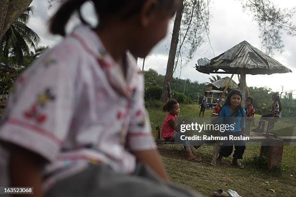 Displaced Sulu villagers play in a camp set up by the Malaysian Government in Felda Imbara Budi, few kilometres away from the "redzone" which the...