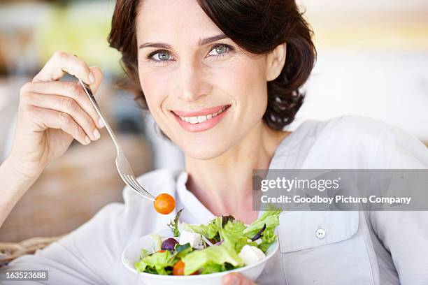 the picture of health and vitality - mature women eating stock pictures, royalty-free photos & images