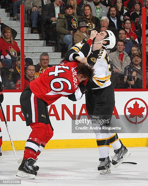 Patrick Wiercioch of the Ottawa Senators fights with Adam McQuaid of the Boston Bruins during first period action on March 11, 2013 at Scotiabank...