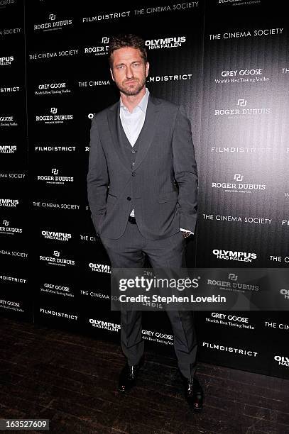 Actor Gerard Butler attends The Cinema Society with Roger Dubuis and Grey Goose screening of FilmDistrict's "Olympus Has Fallen" at Tribeca Grand...