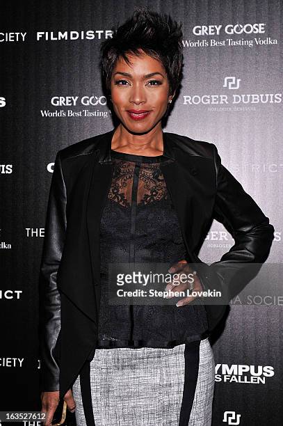 Actress Angela Bassett attends The Cinema Society with Roger Dubuis and Grey Goose screening of FilmDistrict's "Olympus Has Fallen" at Tribeca Grand...