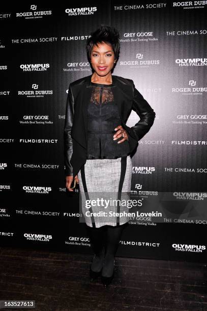 Actress Angela Bassett attends The Cinema Society with Roger Dubuis and Grey Goose screening of FilmDistrict's "Olympus Has Fallen" at Tribeca Grand...