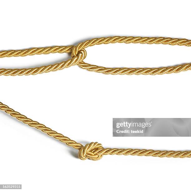 golden rope - red belt stock pictures, royalty-free photos & images