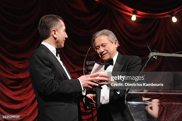 Seder Bulun accepts an award from Endometriosis Foundation founder Tamer Seckin onstage at the Endometriosis Foundation of America's Celebration of...