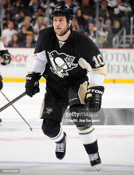 Tanner Glass of the Pittsburgh Penguins skates against the New York Islanders on March 10, 2013 at Consol Energy Center in Pittsburgh, Pennsylvania.