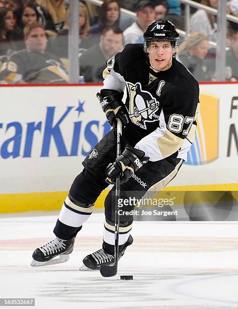 Sidney Crosby of the Pittsburgh Penguins moves the puck against the New York Islanders on March 10, 2013 at Consol Energy Center in Pittsburgh,...