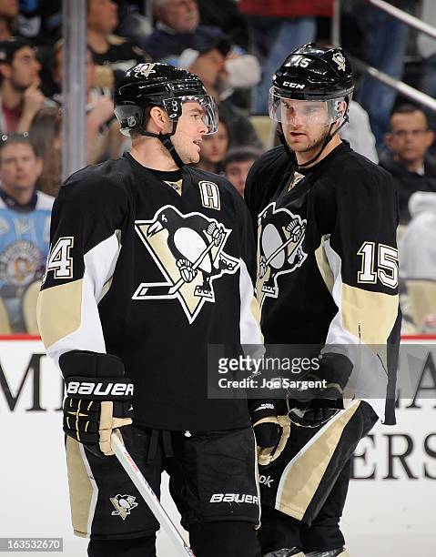Chris Kunitz of the Pittsburgh Penguins talks with Dustin Jeffrey during the game against the New York Islanders on March 10, 2013 at Consol Energy...