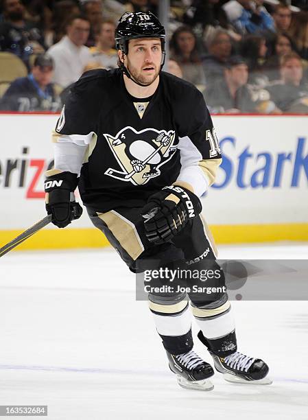 Tanner Glass of the Pittsburgh Penguins skates against the New York Islanders on March 10, 2013 at Consol Energy Center in Pittsburgh, Pennsylvania.