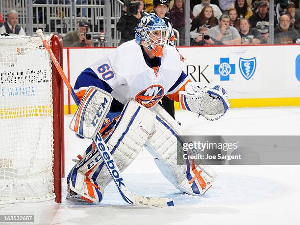 Kevin Poulin of the New York Islanders defends the net against the Pittsburgh Penguins on March 10, 2013 at Consol Energy Center in Pittsburgh,...