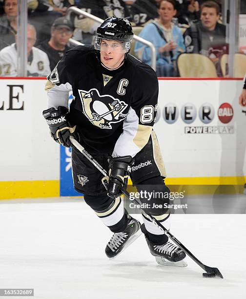 Sidney Crosby of the Pittsburgh Penguins controls the puck against the New York Islanders on March 10, 2013 at Consol Energy Center in Pittsburgh,...