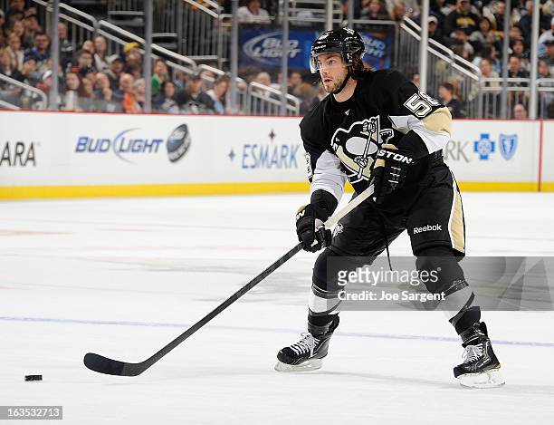 Kris Letang of the Pittsburgh Penguins moves the puck against the New York Islanders on March 10, 2013 at Consol Energy Center in Pittsburgh,...