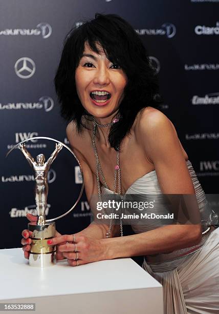 Actress Maggie Cheung poses with the trophy at the 2013 Laureus World Sports Awards at the Theatro Municipal Do Rio de Janeiro on March 11, 2013 in...