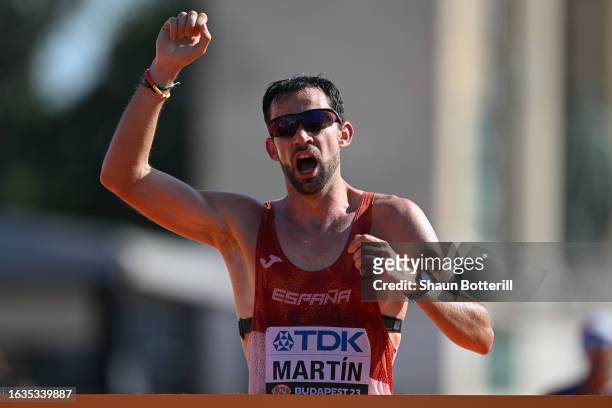 Alvaro Martin of Team Spain celebrates as he crosses the finish line to win the Men's 35 Kilometres Race Walk Final during day six of the World...