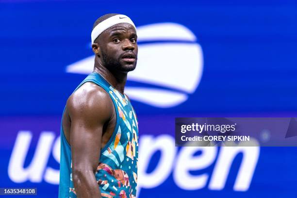 S Frances Tiafoe walks to the baseline as he plays against Austria's Sebastian Ofner during the US Open tennis tournament men's singles second round...