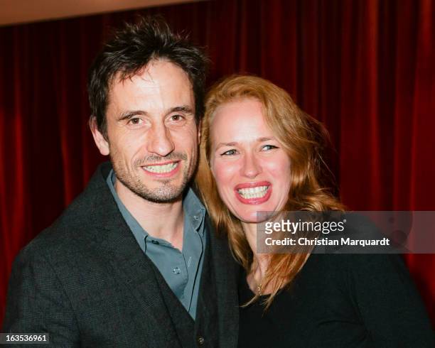 Oliver Mommsen and his wife Nicola Mommsen during the Premiere of 'Eine ganz normale Familie' at the Theater am Kurfuerstendamm on March 11, 2013 in...