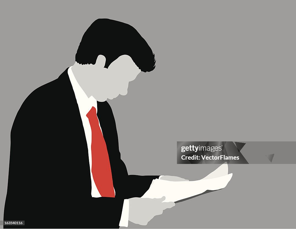 Man Looking at Papers