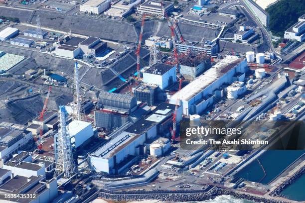 In this aerial image, crippled reactors of the Tokyo Electric Power Co Fukushima Daiichi nuclear power plant are seen on August 24, 2023 in Okuma,...