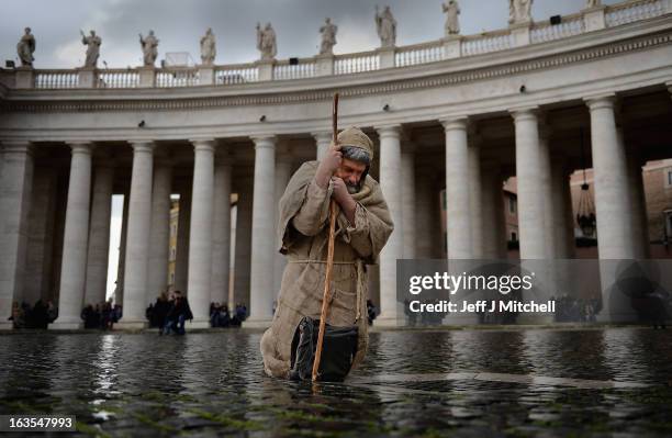 Pilgrims gather in St Peter's Square as cardinals attend mass before entering the conclave on March 12, 2013 in Vatican City, Vatican. Pope Benedict...