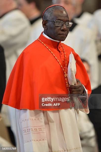 Guinean cardinal Robert Sarah attends a mass at the St Peter's basilica on March 12, 2013 at the Vatican. Cardinals moved into the Vatican today as...