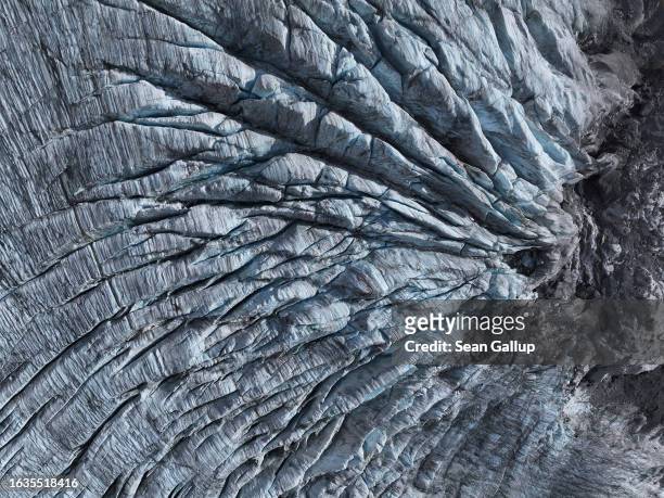 In this aerial view crevasses line the tongue of the Gepatschferner glacier descending on August 22, 2023 above Kaunertal, Austria. Martin...