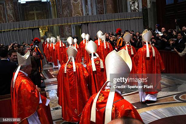 Cardinals exit St Peter's Basilica after they attended the Pro Eligendo Romano Pontifice Mass before they will enter the conclave to decide who the...