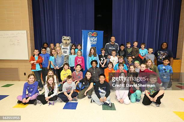 Greg Stiemsma and mascot Crunch of the Minnesota Timberwolves pose for a group picture following a Reading Timeout as part of the Minnesota...