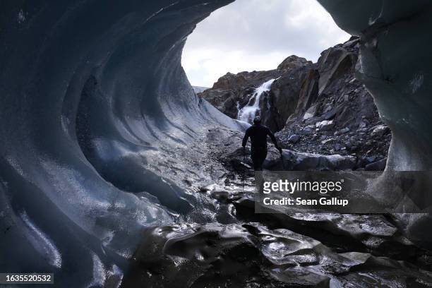 Martin Stocker-Waldhuber, a glaciologist with the Institute for Interdisciplinary Mountain Research of the Austrian Academy of Sciences, walks inside...