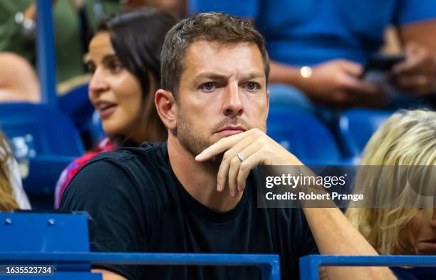 Former basketball player David Lee watches his wife Caroline Wozniacki of Denmark play against Petra Kvitova of the Czech Republic during the women's...