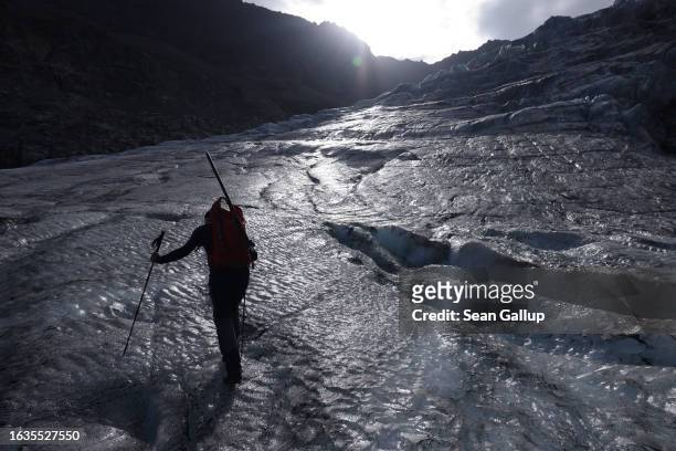 Martin Stocker-Waldhuber, a glaciologist with the Institute for Interdisciplinary Mountain Research of the Austrian Academy of Sciences, walks on the...